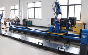 Head and tailstock positioner robotic welding station with robot mounted on RTU track